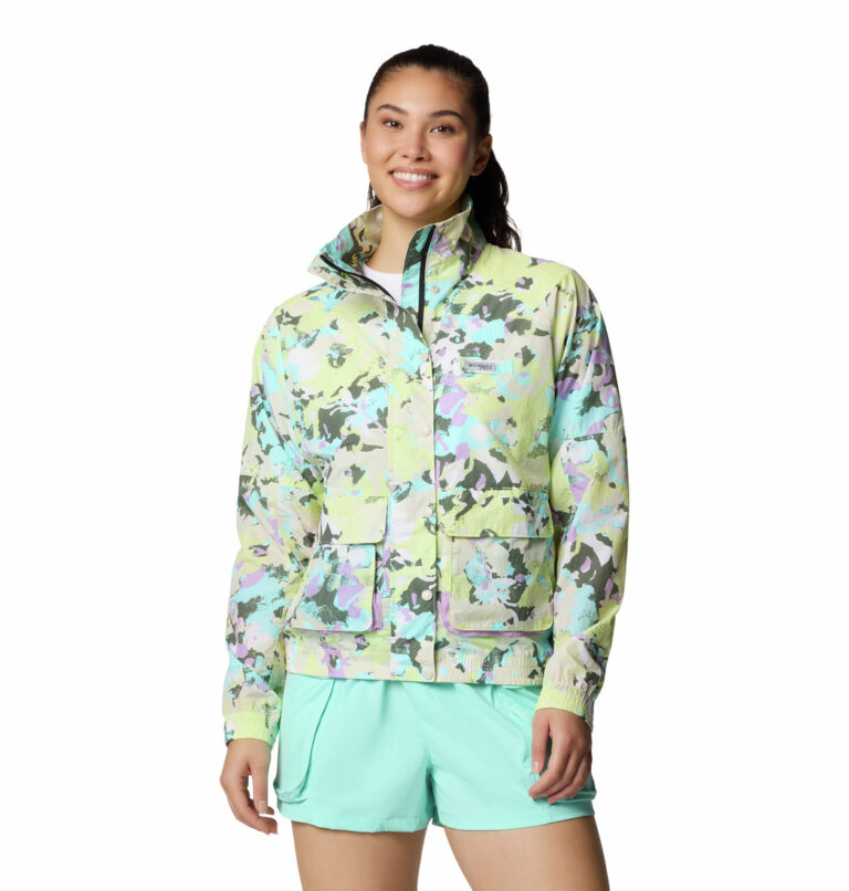 A women wearing a muti coloured windbreaker jacket