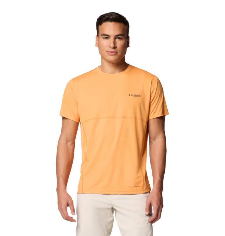 A man wearing a orange short sleeve shirt