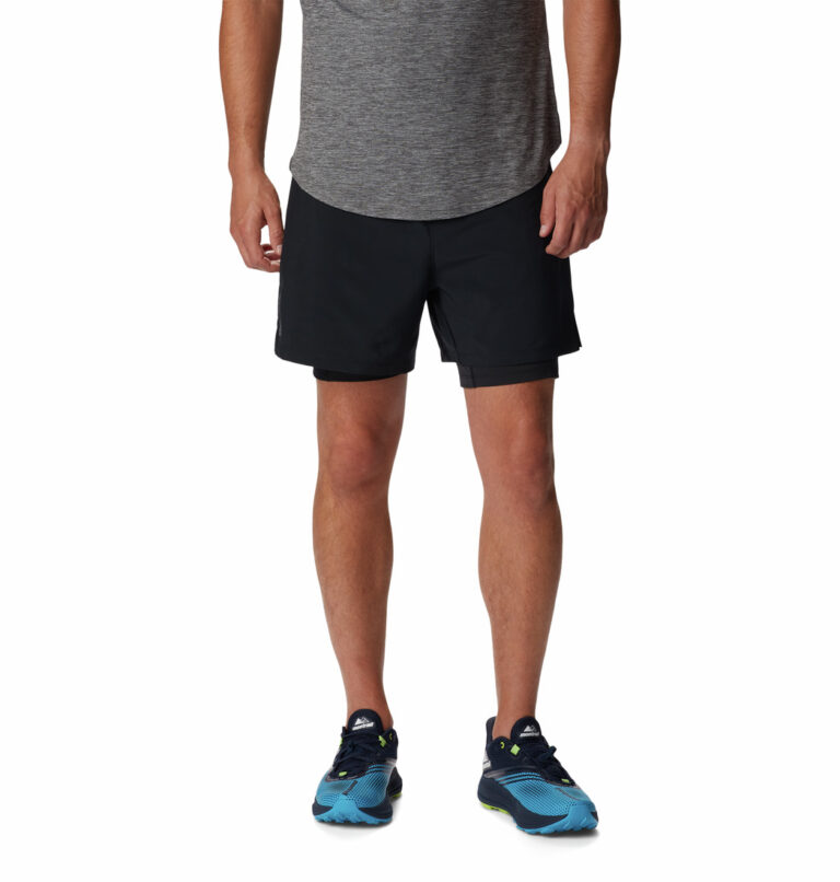 A man wearing black shorts