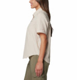 A Women wearing a brown short sleeve shirt
