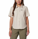 A Women wearing a brown short sleeve shirt