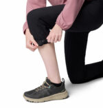 A Women wearing black pants