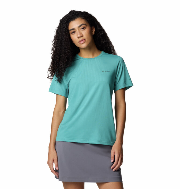 A women wearing a blue Wild Springs short sleeve shirt