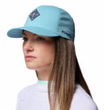 a woman wearing a blue cap