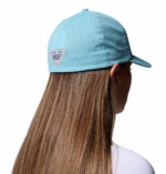 a woman wearing a blue cap