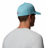 a man wearing a blue cap