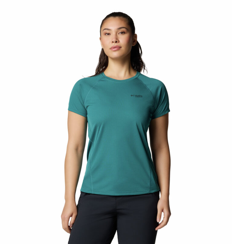 A women wearing a blue short sleeve shirt
