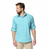 A man wearing a blue long sleeve shirt