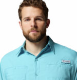 A man wearing a blue long sleeve shirt
