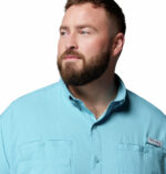 A man wearing a blue long sleeve shirt