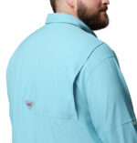 A man wearing a blue long sleeve shirt