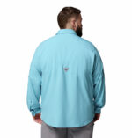 A man wearing a blue long sleeve shirt