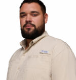 A man wearing a brown short sleeve shirt