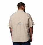 A man wearing a brown short sleeve shirt