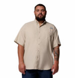 A man wearing a brown short sleeve shirt