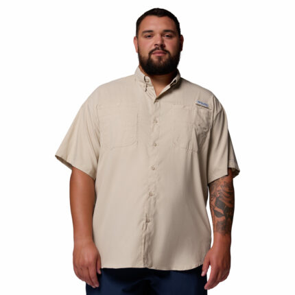A man wearing a brown short sleeve shirt