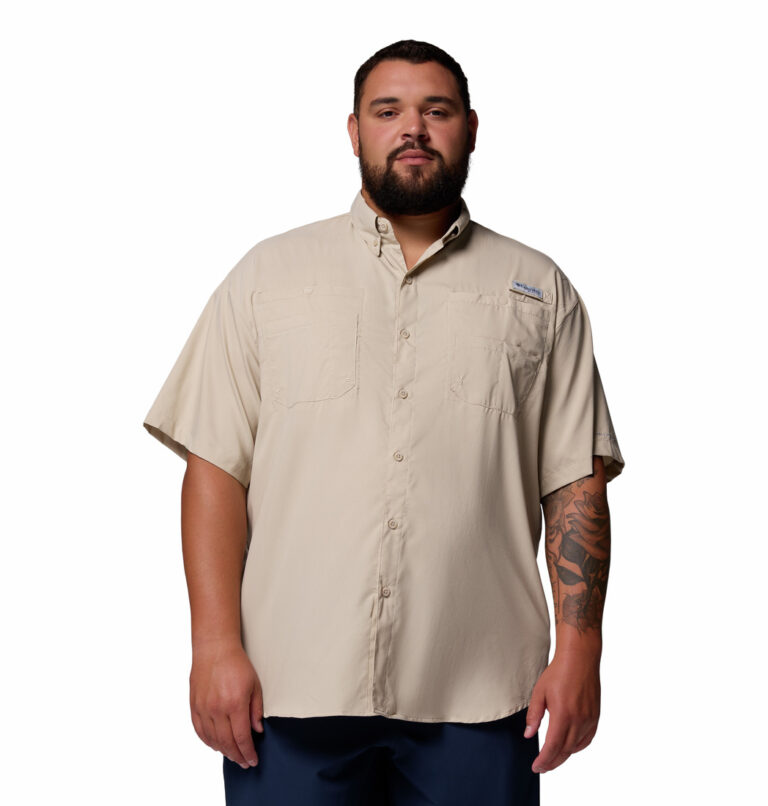 A man wearing a brown short sleeve shirt