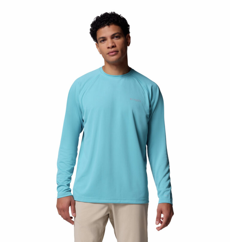 A man wearing a blue long sleeve shirt