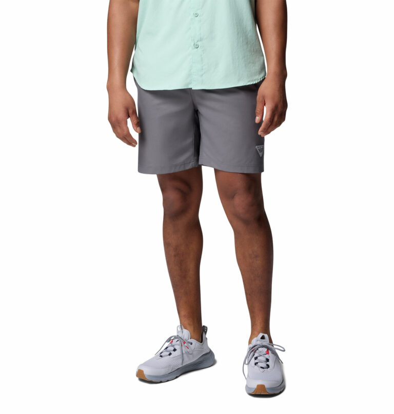 A man wearing fishing shorts