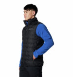 A man wearing a black vest