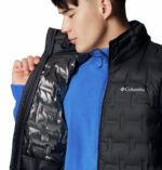 A man wearing a black vest
