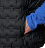 A man wearing a black vest