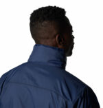 a man wearing a blue jacket
