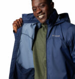 a man wearing a blue jacket