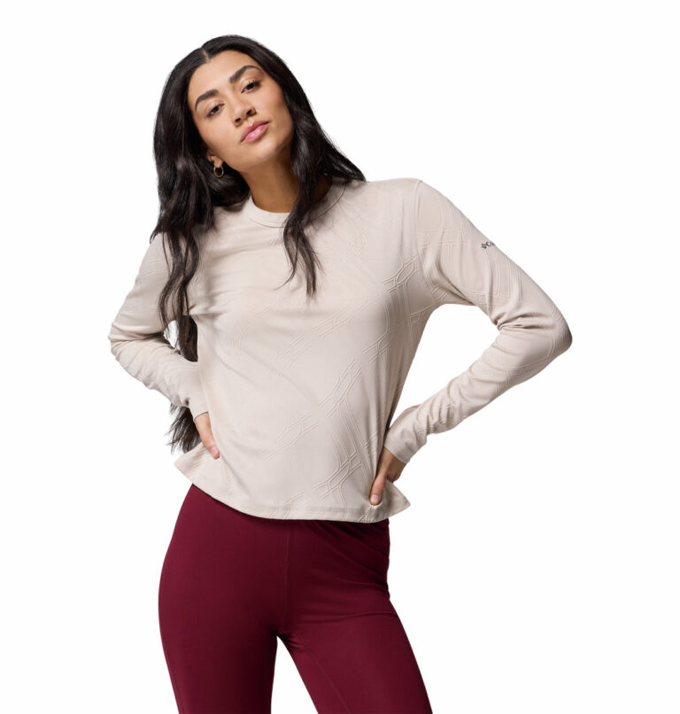 a women wearing a brown long sleeve crew shirt