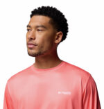 A man wearing a pink long sleeve shirt