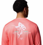 A man wearing a pink long sleeve shirt