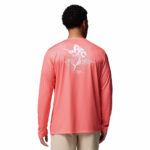 A man wearing a pink long sleeve shirt