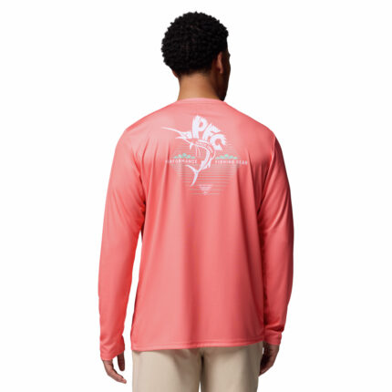 A man wearing a pink long sleeve shirt