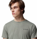 A man wearing a brown short sleeve Tee