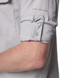 a man wearing a grey long sleeve shirt