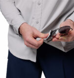 a man wearing a grey long sleeve shirt