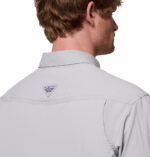 a man wearing a grey long sleeve shirt