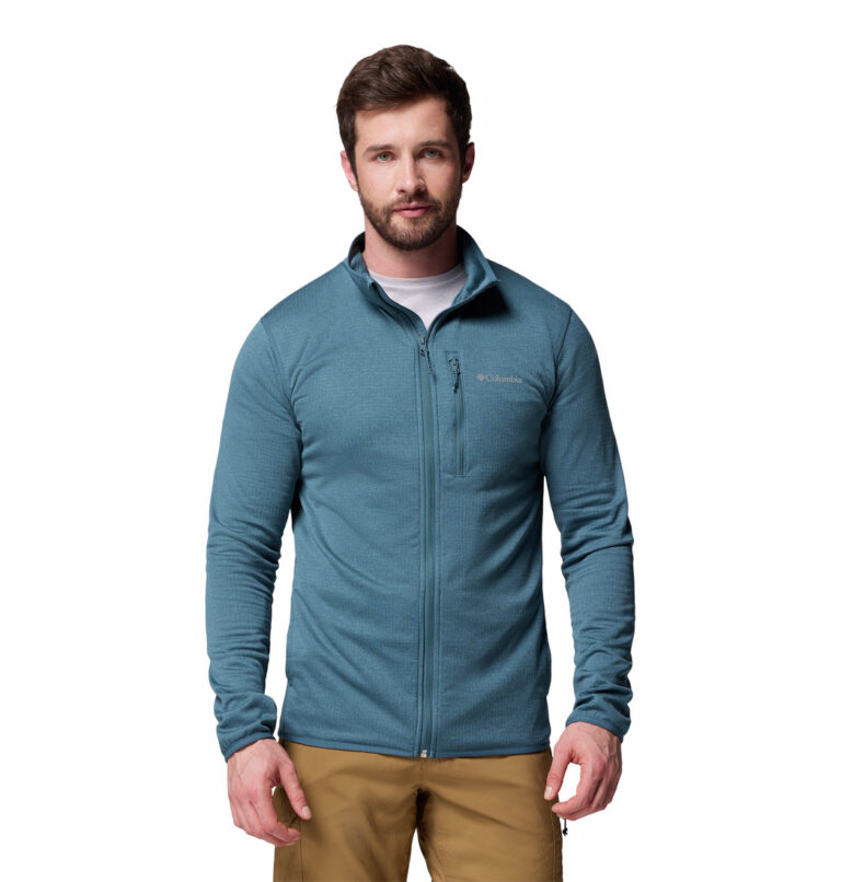 A man wearing a blue Essential Hike full zip fleece jacket