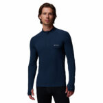 a man wearing a blue Midweight Half Zip Stretch Shirt