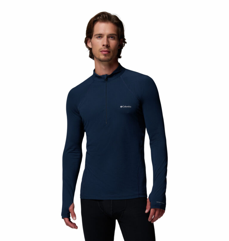 a man wearing a blue Midweight Half Zip Stretch Shirt