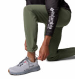 A man wearing brown stretch pants