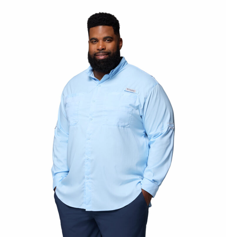 a man wearing a blue Tamiami II Long Sleeve Shirt