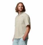 a man wearing a brown Tamiami II Short Sleeve Shirt