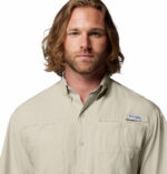 a man wearing a brown Tamiami II Short Sleeve Shirt