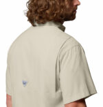 a man wearing a brown Tamiami II Short Sleeve Shirt