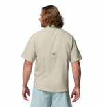 a man wearing a brown Tamiami II Short Sleeve Shirt