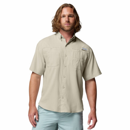 a man wearing a brown Tamiami II Short Sleeve Shirt