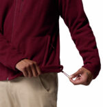 a man wearing a red fleece top