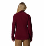 a women wearing a red glacial iv half zip fleece jacket