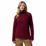 a women wearing a red glacial iv half zip fleece jacket